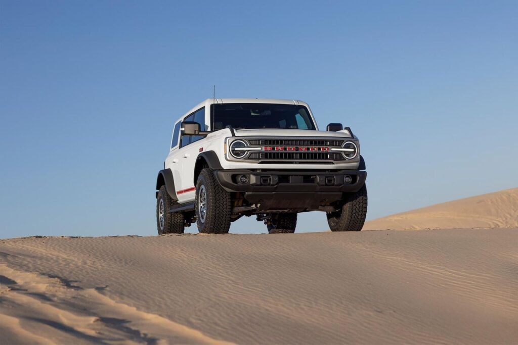 2026 Ford Bronco SUV in white, front three-quarter view in desert