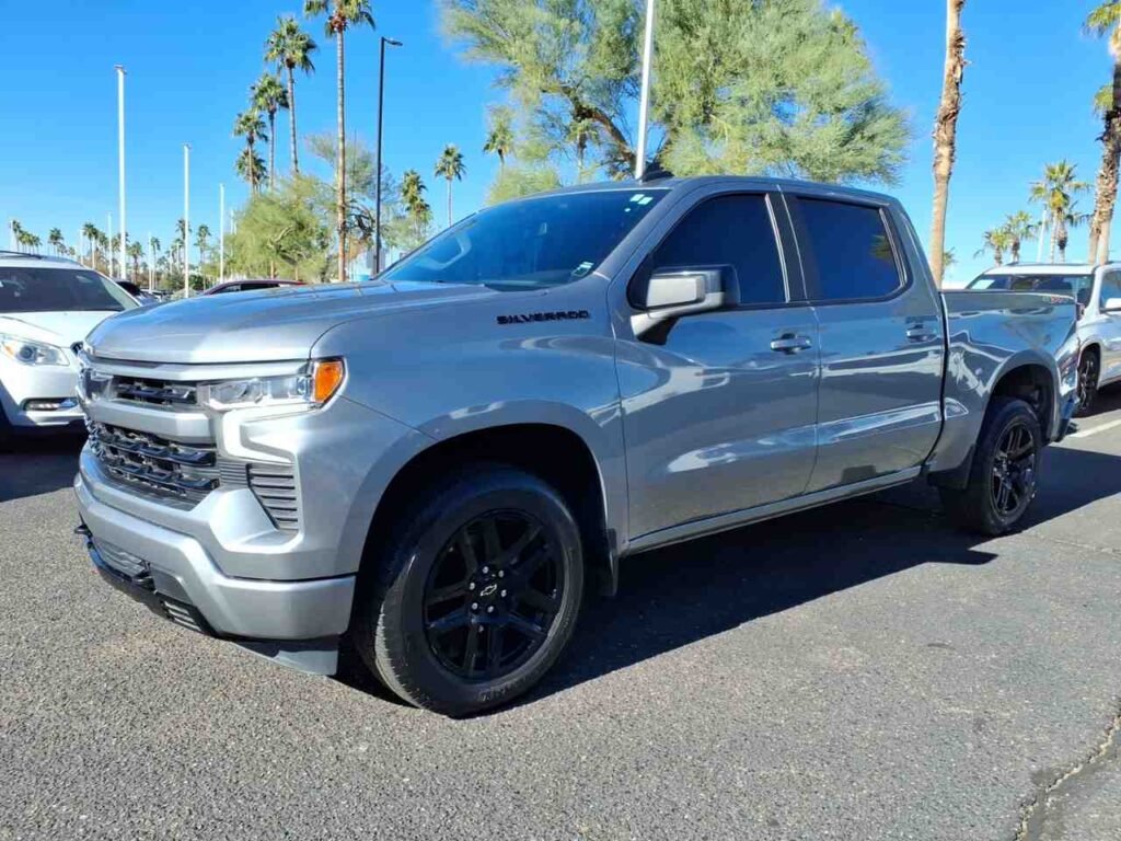 2023 Chevrolet Silverado 1500 RST pickup truck in silver, front three-quarter view